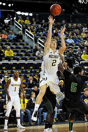 Glenn Robinson III (1) and Spike Albrecht (2)