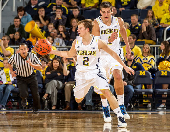 Spike Albrecht (2) and Mitch McGary (4)