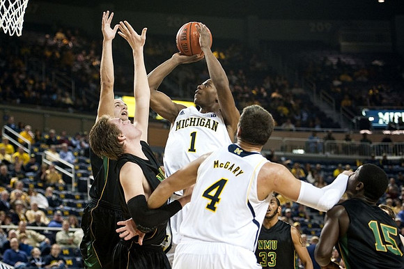 Glenn Robinson III (1) and Mitch McGary (4)