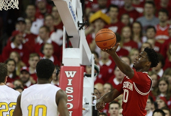 Duncan Robinson (22) and Derrick Walton Jr. (10)