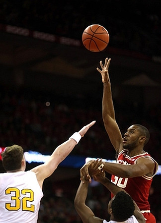 Ricky Doyle (32) and Derrick Walton Jr. (10)