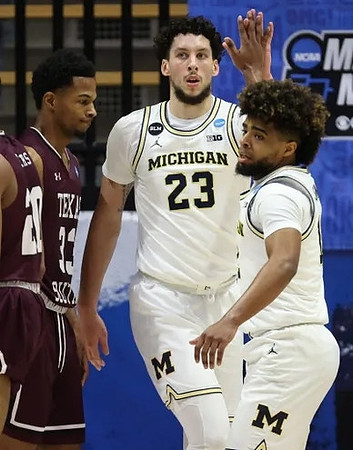 Brandon Johns Jr. (23) and Mike Smith (12)