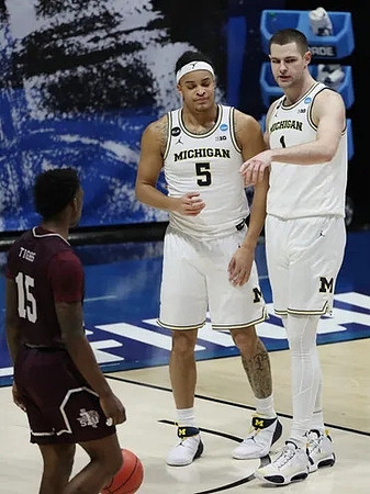 Terrance Williams II (5) and Hunter Dickinson (1)