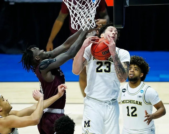 Brandon Johns Jr. (23) and Mike Smith (12)
