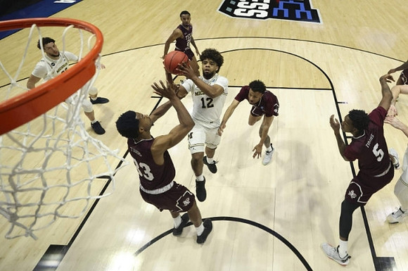 Brandon Johns Jr. (23) and Mike Smith (12)