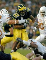 Michael Hart (20) and Chad Henne (7)