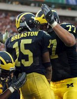 Steve Breaston (15) and Jake Long (77)