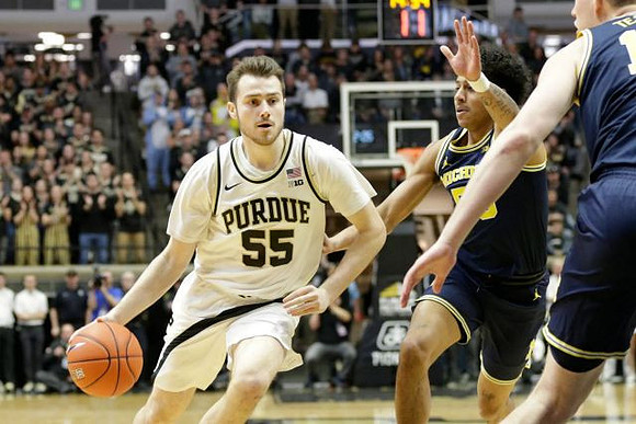 Eli Brooks (55) and Jon Teske (15)