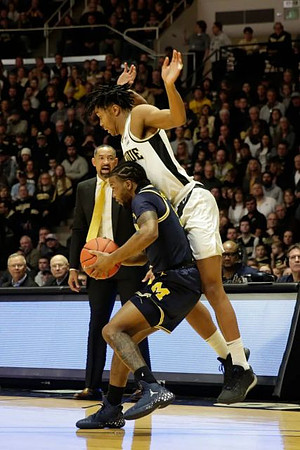 Zavier Simpson (3) and Juwan Howard