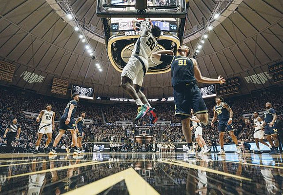 Brandon Johns Jr. (23), Austin Davis (51), Eli Brooks (55), Isaiah Livers (2), and Zavier Simpson (3)