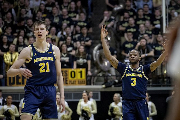Franz Wagner (21) and Zavier Simpson (3)