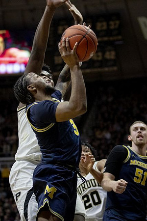 Zavier Simpson (3) and Austin Davis (51)