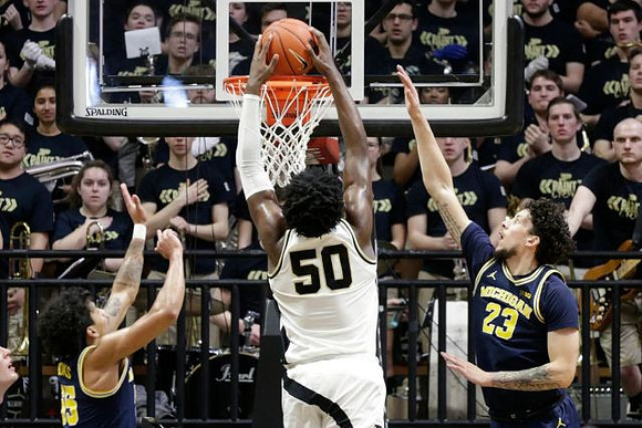 Eli Brooks (55) and Brandon Johns Jr. (23)