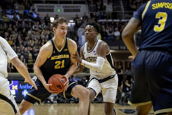 Franz Wagner (21) and Zavier Simpson (3)