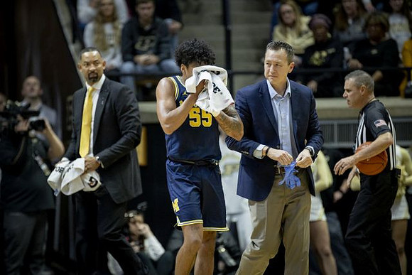 Juwan Howard and Eli Brooks (55)