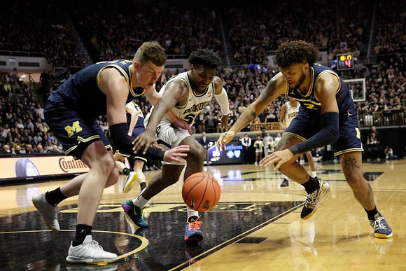 Jon Teske (15) and Isaiah Livers (2)