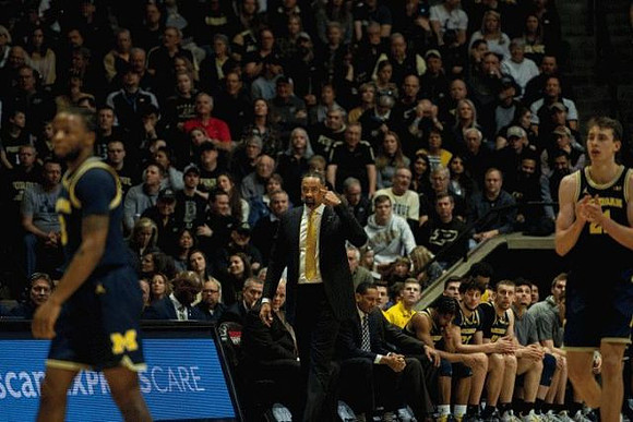Zavier Simpson (3), Juwan Howard, and Franz Wagner (21)