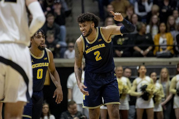 David DeJulius (0) and Isaiah Livers (2)