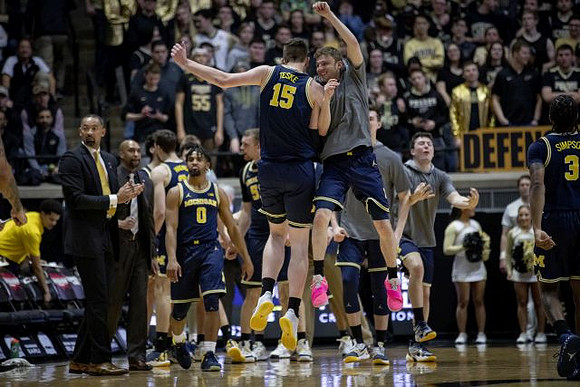 Jon Teske (15), Luke Wilson (32), and Zavier Simpson (3)