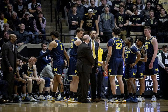 Michigan Team and Juwan Howard