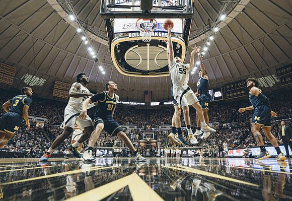 Zavier Simpson (3), Austin Davis (51), Eli Brooks (55), Isaiah Livers (2), and Juwan Howard