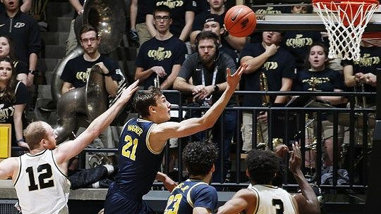 Franz Wagner (21) and Brandon Johns Jr. (23)