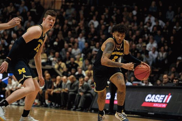 Jon Teske (15) and Isaiah Livers (2)
