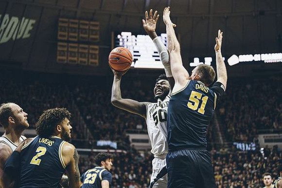 Isaiah Livers (2), Brandon Johns Jr. (23), and Austin Davis (51)