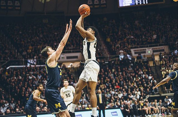 David DeJulius (0), Franz Wagner (21), and Zavier Simpson (3)