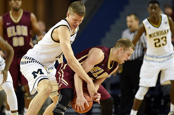 Moritz Wagner (13) and Caris LeVert (23)