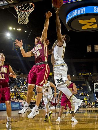 Derrick Walton Jr. (10) and Mark Donnal (34)