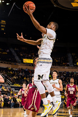 Muhammad-Ali Abdur-Rahkman (12) and D.J. Wilson (5)