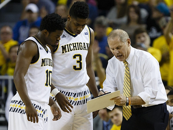 Derrick Walton Jr. (10), Kameron Chatman (3), and John Beilein
