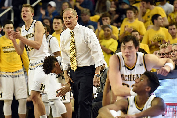 Moritz Wagner (13), D.J. Wilson (5), John Beilein, Ricky Doyle (32), and Aubrey Dawkins (24)
