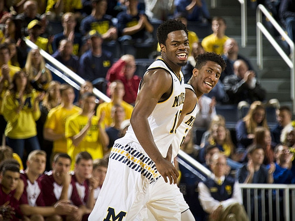 Derrick Walton Jr. (10) and Aubrey Dawkins (24)