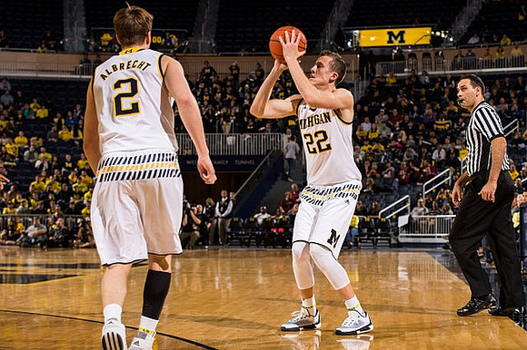 Spike Albrecht (2) and Duncan Robinson (22)