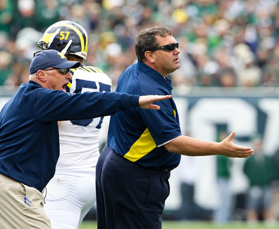 Elliott Mealer (57) and Brady Hoke