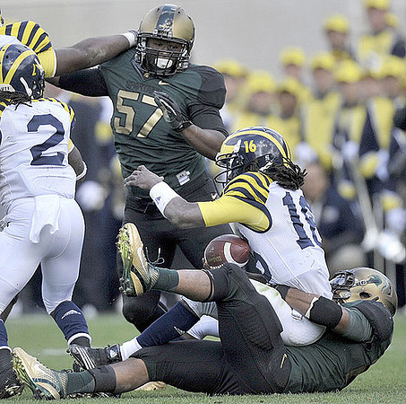 Vincent Smith (2) and Denard Robinson (16)