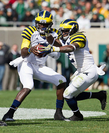 Denard Robinson (16) and Vincent Smith (2)