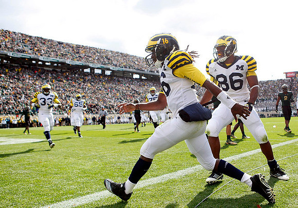 Stephen Hopkins (33), Patrick Omameh (65), Denard Robinson (16), and Kevin Koger (86)