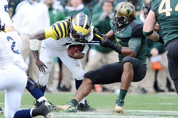Vincent Smith (2) and Denard Robinson (16)