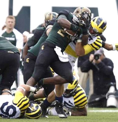 Jake Ryan (90) and Kenny Demens (25)