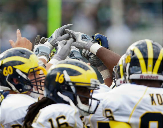 Jack Miller (60), Denard Robinson (16), and Kevin Koger (86)