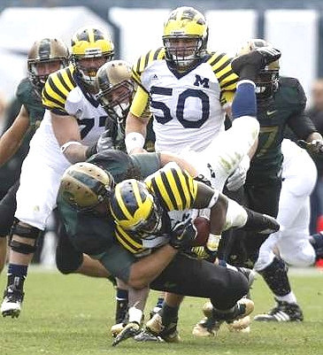 Vincent Smith (2), Taylor Lewan (77), and David Molk (50)
