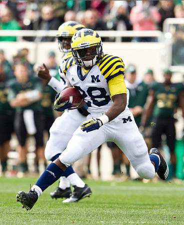 Denard Robinson (16) and Fitzgerald Toussaint (28)