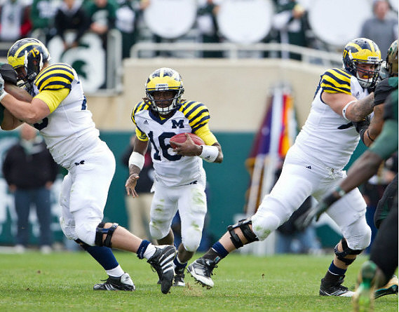 Michael Schofield (75), Denard Robinson (16), and Taylor Lewan (77)