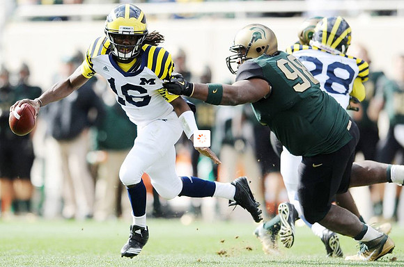 Denard Robinson (16) and Fitzgerald Toussaint (28)