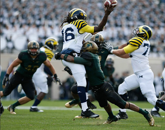 Denard Robinson (16) and Taylor Lewan (77)