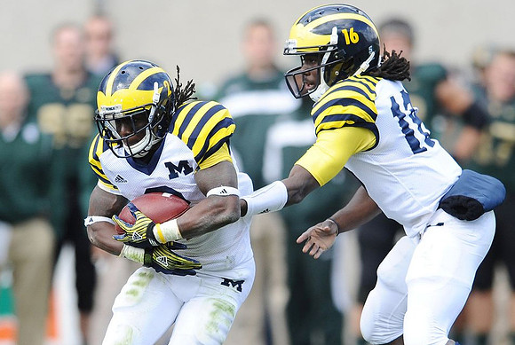 Vincent Smith (2) and Denard Robinson (16)