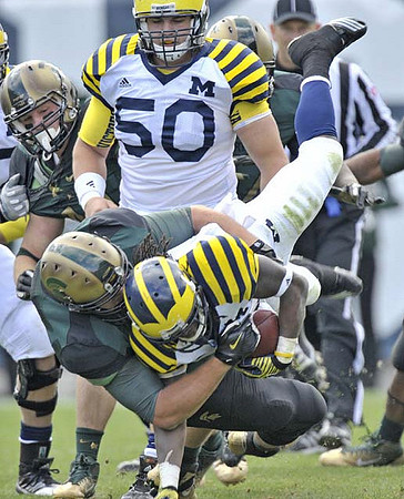 Vincent Smith (2) and David Molk (50)